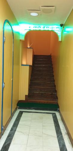 a hallway with a staircase in a room at Pensao Residencial Flor dos Cavaleiros in Lisbon
