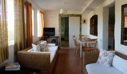 a living room with a couch and chairs and a table at Apartments-Estate under the Paintbrush in Vis