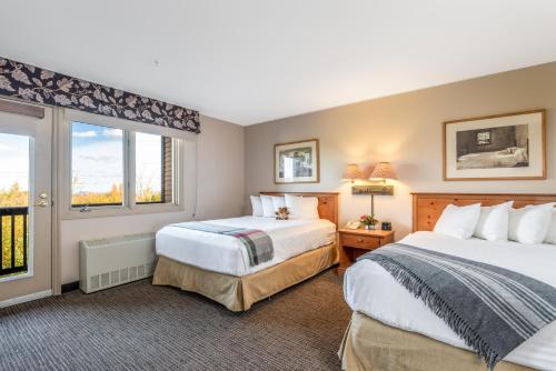a hotel room with two beds and a window at Jordan Hotel in Newry