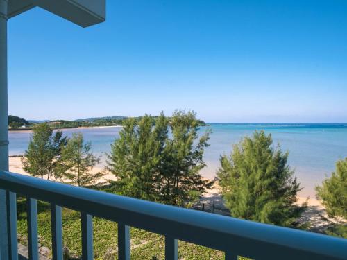 a view of the beach from a balcony at Hotel Hoshitate Iriomotejima in Iriomote