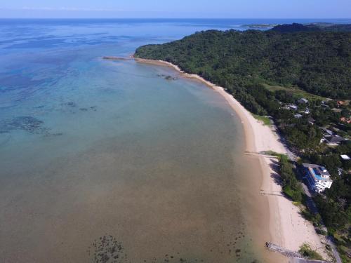 an aerial view of a beach and the ocean at Hotel Hoshitate Iriomotejima in Iriomote