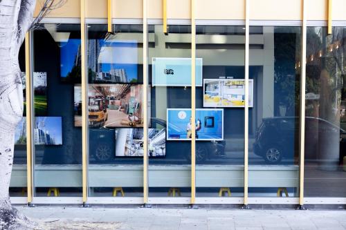 a display window of a building with photos in it at ibis Styles East Perth in Perth