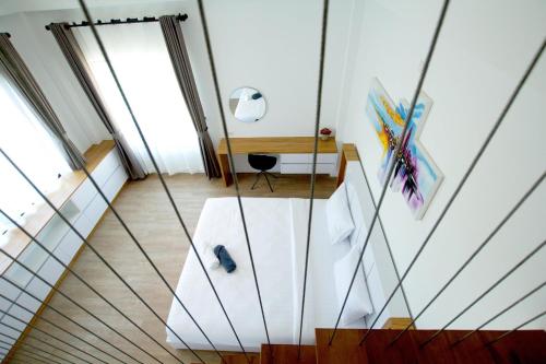 a room with a staircase with glass walls at Happy Family Villa in Phuket Town