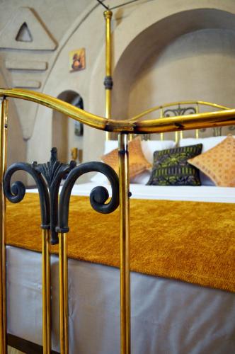 a bedroom with a bed with a gold bed frame at Djorff Palace in Luxor