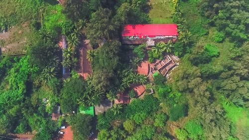 an aerial view of a house in a forest at Lotus an Eco Beach Resort Dapoli Murud in Dapoli