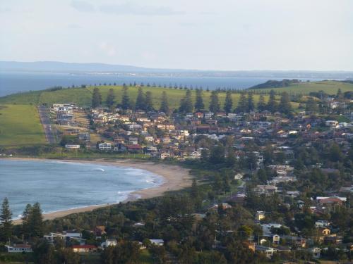an aerial view of a beach with houses at Park Ridge Retreat in Gerringong