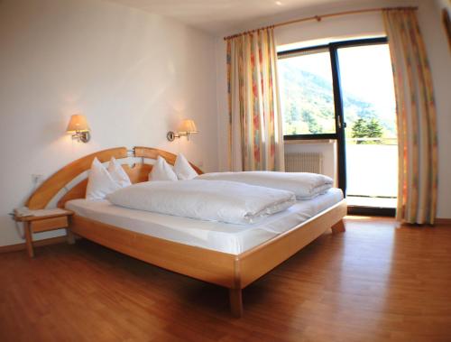 Postel nebo postele na pokoji v ubytování Residence Andrea