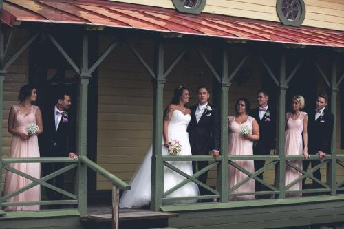 a bride and groom and their wedding party in a gazebo at Gustafsbergs Badhotell & Vandrarhem in Uddevalla