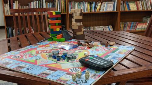 a table with a remote control on top at Howard Beach Resort Kenting in Kenting