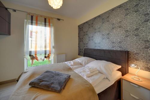 Posteľ alebo postele v izbe v ubytovaní Przytulne Apartamenty Sun Seasons 24 z Pięknym Widokiem w Szklarskiej Porębie by Noclegi Renters