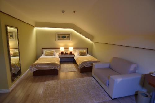 Ένα ή περισσότερα κρεβάτια σε δωμάτιο στο Hotel Sokrat