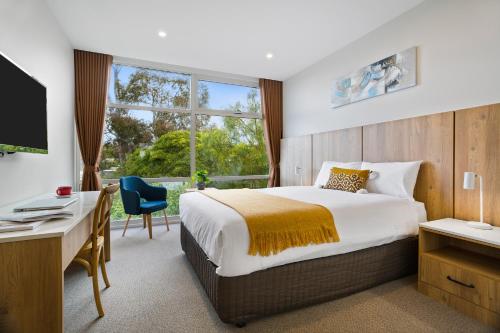 Krevet ili kreveti u jedinici u okviru objekta Parkside Motel Geelong