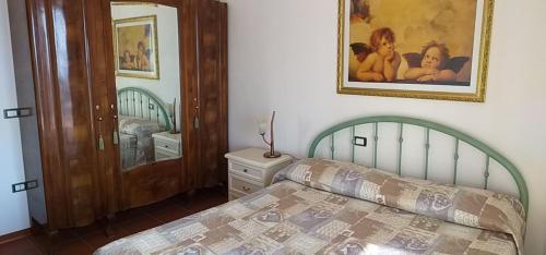 En eller flere senge i et værelse på Villa vista mare con piscina