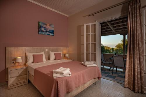 Ένα ή περισσότερα κρεβάτια σε δωμάτιο στο Vasiliki Apartments