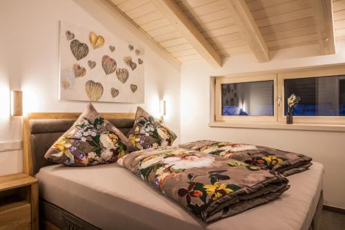 a bedroom with two beds and a window at Haus Lukic in Kaprun