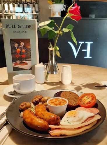a plate of breakfast food on a table at The Village Hotel, Bar and Restaurant in Bettystown