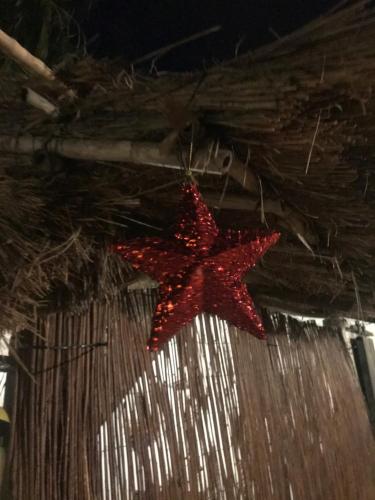 a red star ornament hanging from a wall at El Lagar de los Abuelos in Arcos de la Frontera