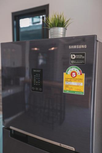 a microwave with a sign on top of it at Aonang nine poolvilla in Ao Nang Beach