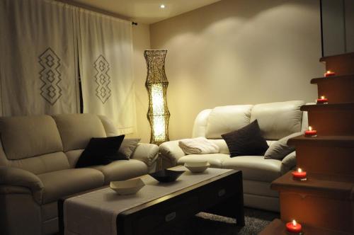 a living room with a couch and a coffee table at El Cañizar in Villarquemado