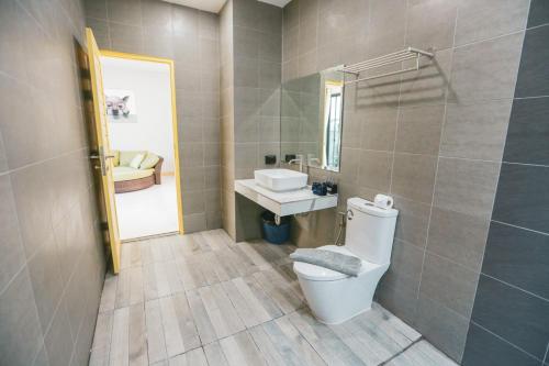 a bathroom with a toilet and a sink at Aonang nine poolvilla in Ao Nang Beach