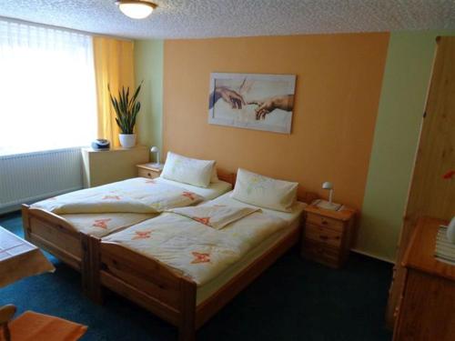 a bedroom with a large bed in a room at Appartement Studio Kremser in Kranichfeld