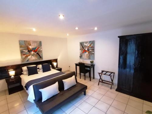 Ένα ή περισσότερα κρεβάτια σε δωμάτιο στο Fourways BnB