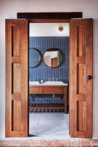 a bathroom with a sink and a mirror at San Rafael in Mompos