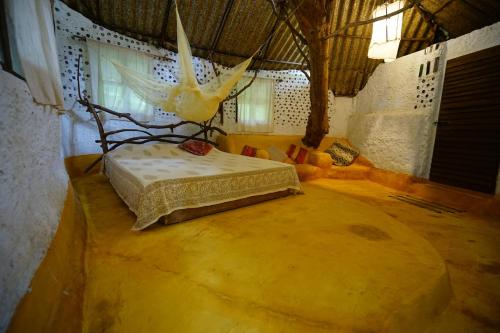 a bedroom with a bed in the middle of a room at Saraya in Sangolda