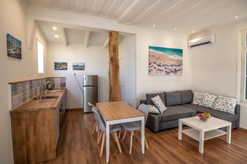 a living room with a couch and a table at Levkosh Apartments at Lefkada's Heart in Lefkada