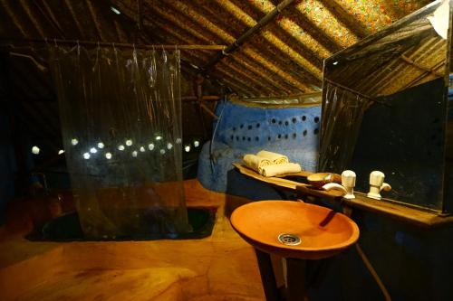 a bathroom with a sink and a shower at Saraya in Sangolda
