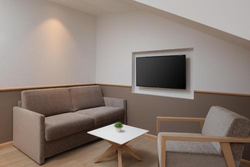 TV a/nebo společenská místnost v ubytování Hotel Tamaris