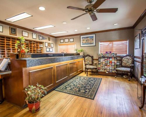 a bar in a library with two chairs and a fan at Tampa Bay Extended Stay - Airport in Tampa