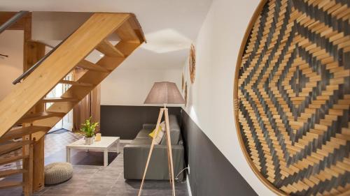 a living room with a circular mirror on the wall at Laniella location in Calvi