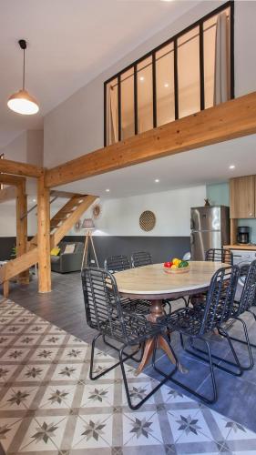 a dining room with a table and chairs at Laniella location in Calvi