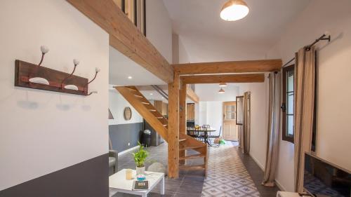 a hallway with a staircase in a house at Laniella location in Calvi