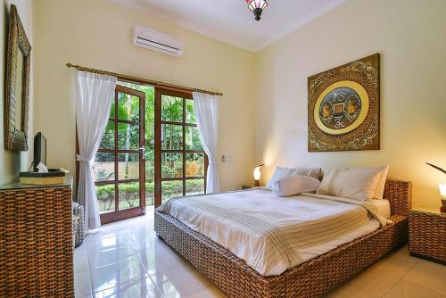 Giường trong phòng chung tại Villa Bidadari - Bali Sea Villas Beachfront and private pool