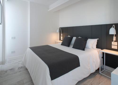 Ένα ή περισσότερα κρεβάτια σε δωμάτιο στο Palacio Paz Boutique Hotel