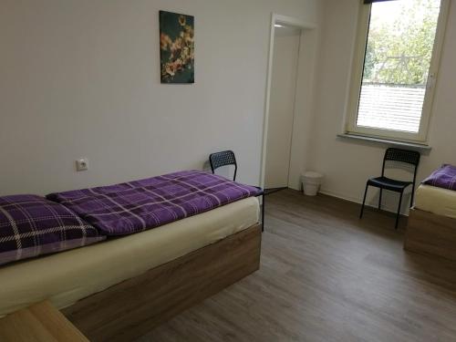 Postel nebo postele na pokoji v ubytování Haupthaus Möblierte Zimmer mit eigenem Bad