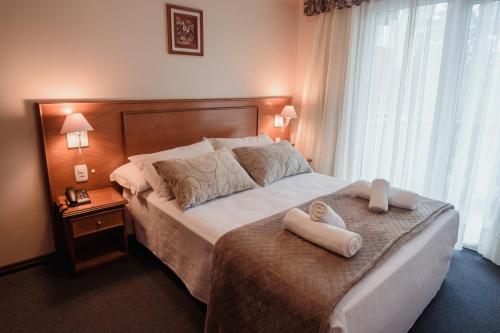 Postel nebo postele na pokoji v ubytování Hotel Vista do Vale