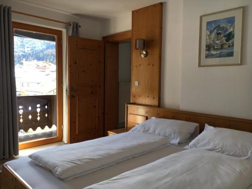 Posteľ alebo postele v izbe v ubytovaní Landhaus Holzereck