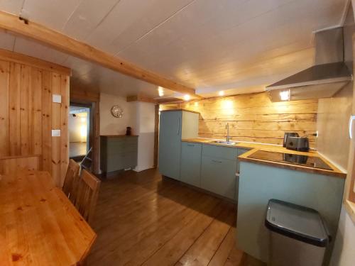 a kitchen with a sink and a counter top at Tgèsa Felici in Sedrun