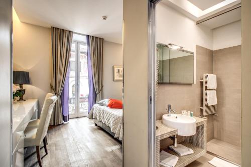 a bathroom with a bed and a sink and a mirror at Roma Boutique Hotel in Rome