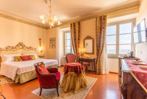Postel nebo postele na pokoji v ubytování Hotel Villa Marsili