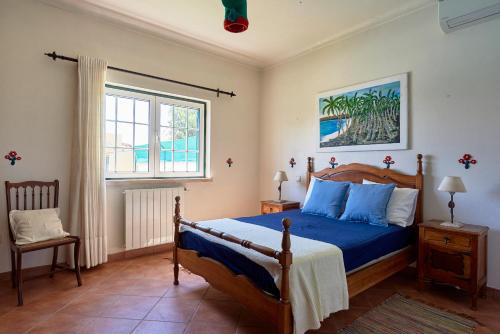 Postel nebo postele na pokoji v ubytování Quinta dos Pastores