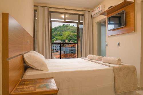 Postel nebo postele na pokoji v ubytování Hotel Casa Alfredo