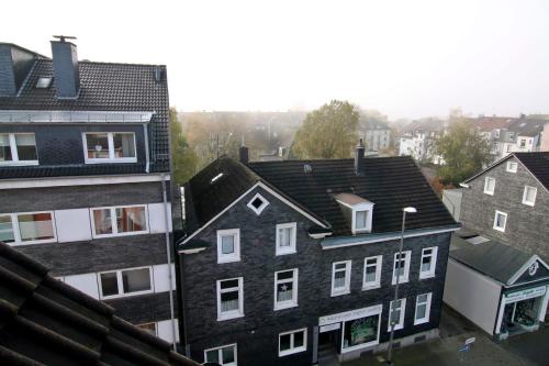 an aerial view of roofs of buildings in a city at apartmondo Apartmentwohnungen Remscheid in Remscheid