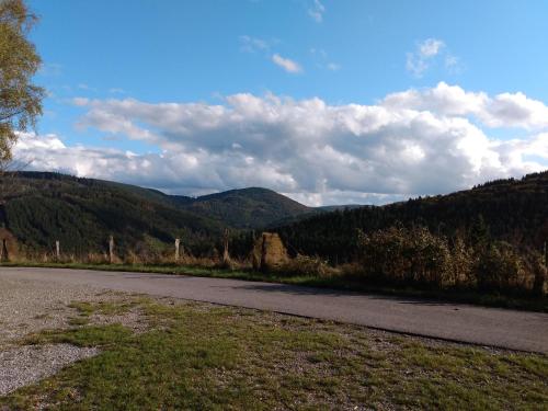 an empty road with mountains in the background at Lavender Hill in Messinghausen