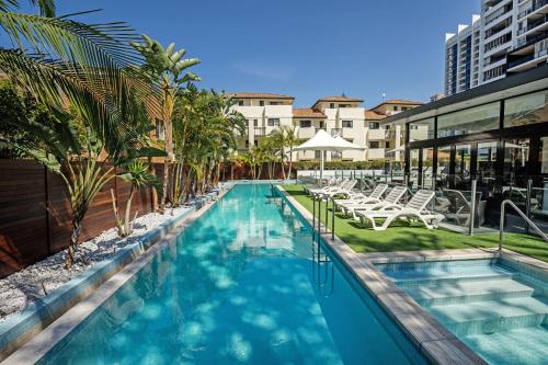 an image of a swimming pool at a hotel at Ultra Broadbeach in Gold Coast