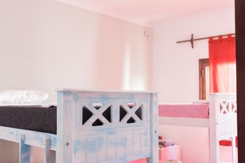 a bedroom with a bed and a dresser in it at La San Francisco II in Salta