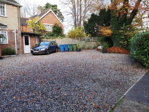 a car parked in the driveway of a house at The Spinney in Bracknell